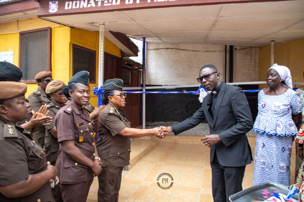 Rev. Samuel K. Darko handing over the shed to DDP Joyce Annor-Owusu